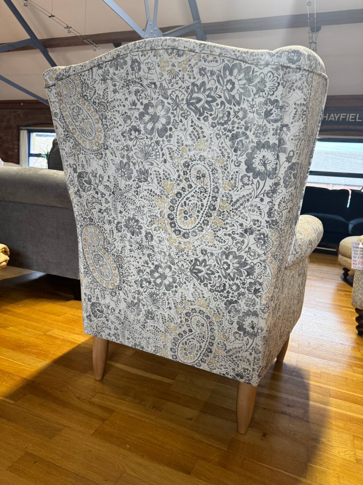 Heather wingback accent chair in grey / ochre Paisley print fabric