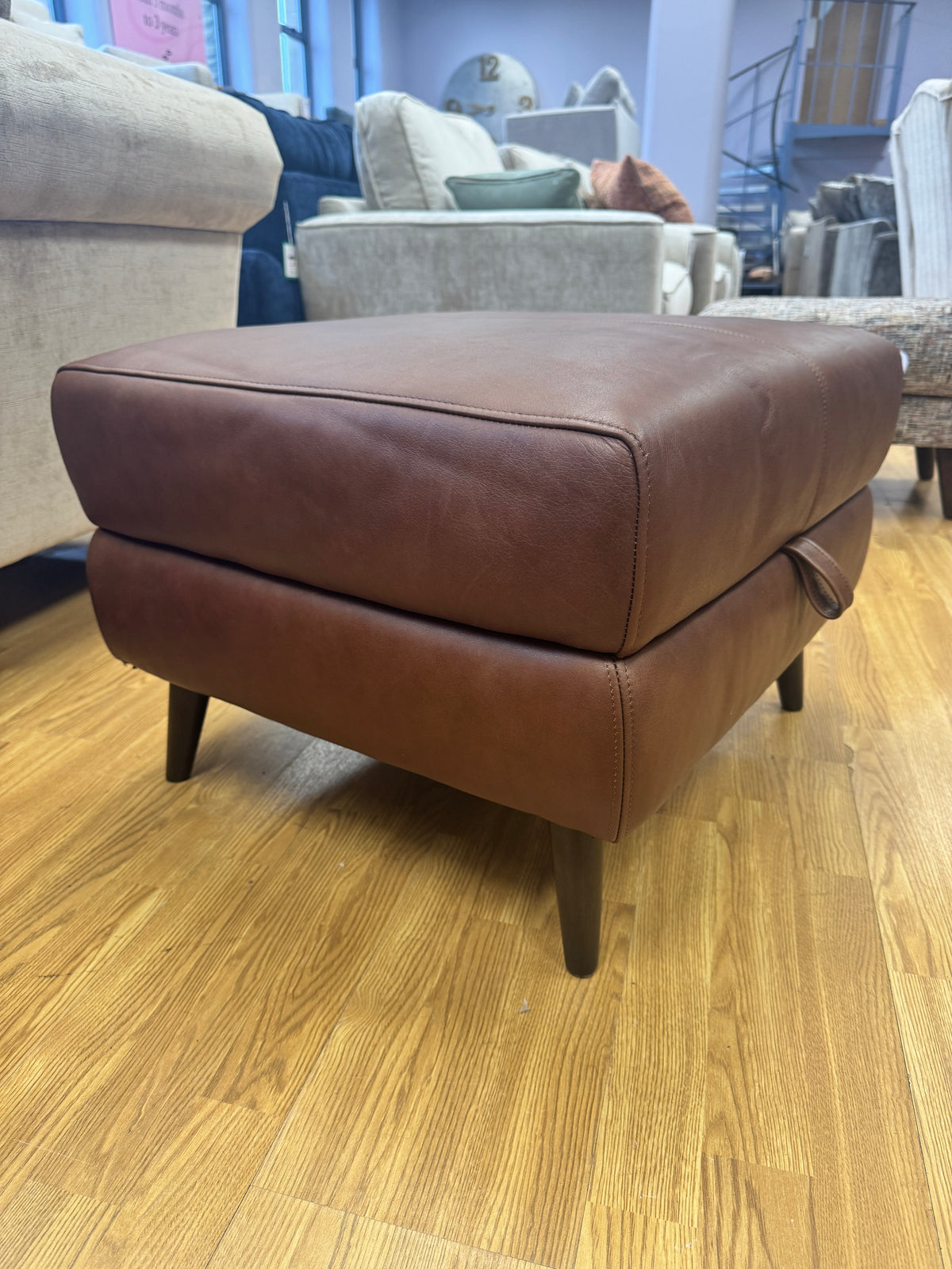 Adler storage footstool in soft tan brown leather