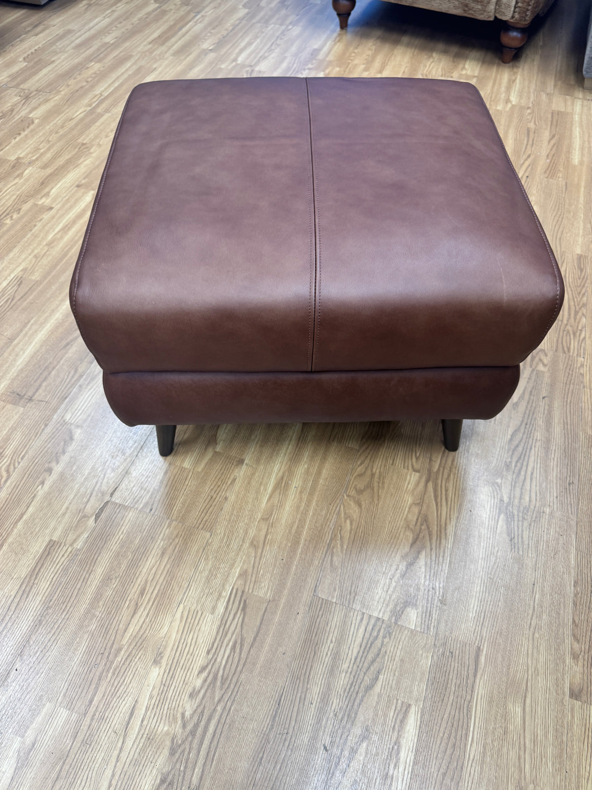 Adler storage footstool in soft tan brown leather
