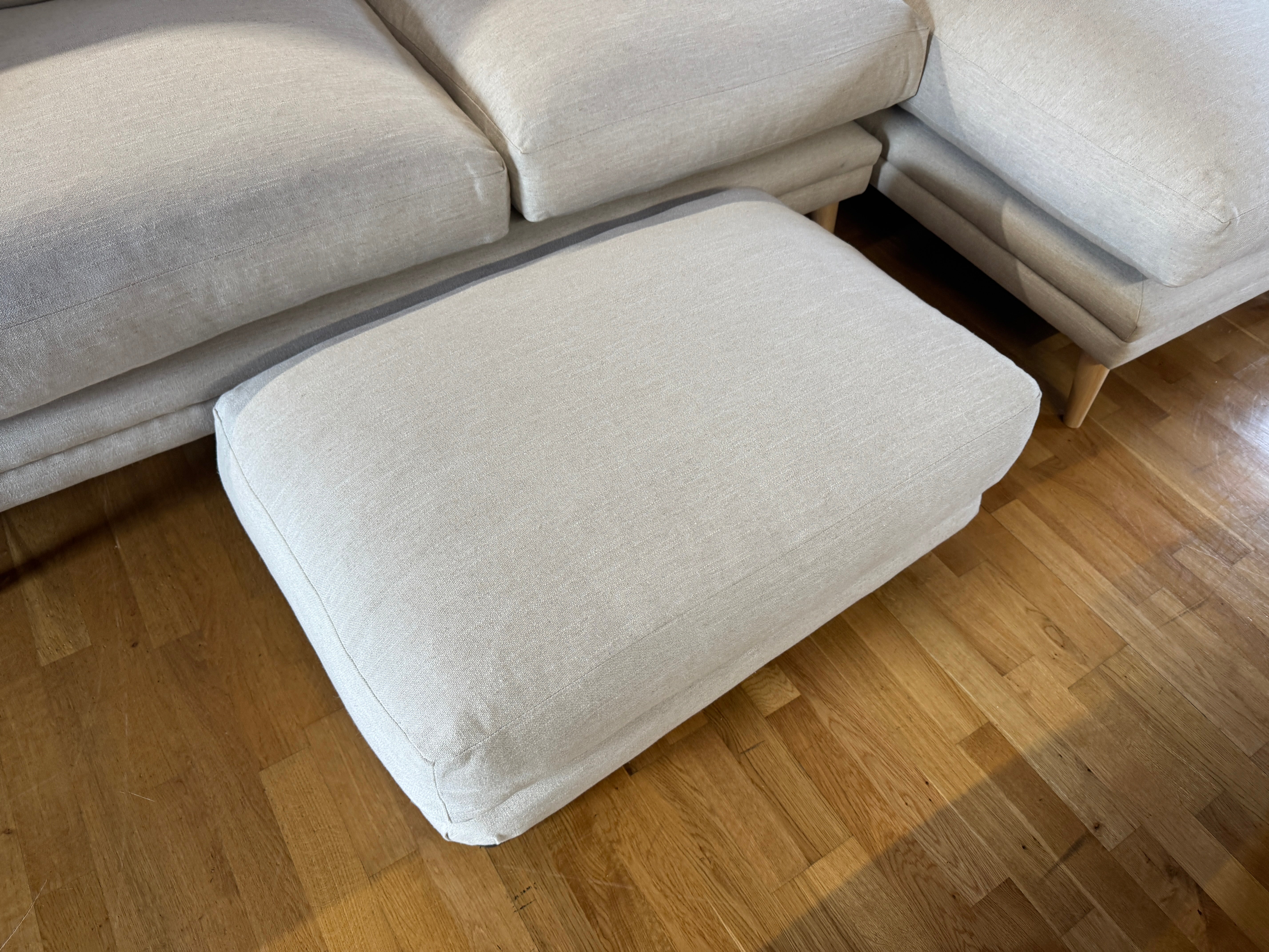 Padded top footstool in clever vintage linen