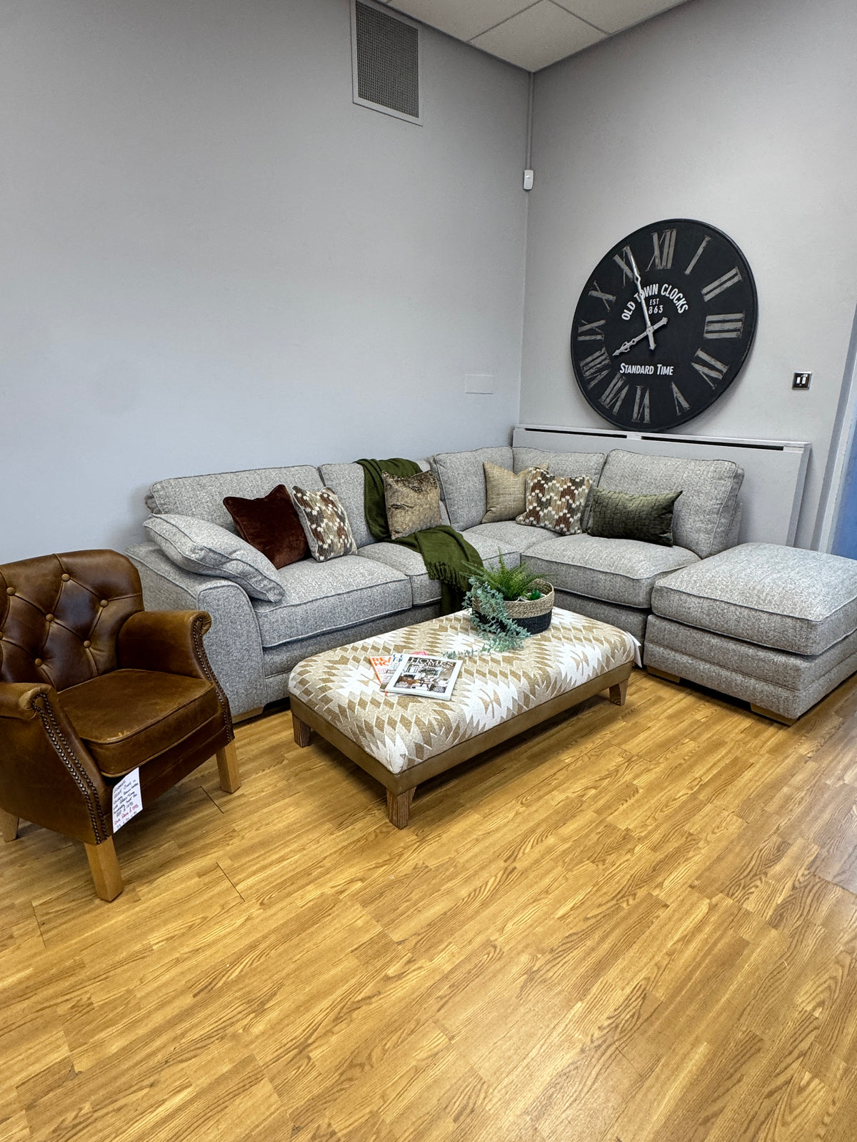 Proto right facing open corner sofa with footstool in Osaka Coppice fabric