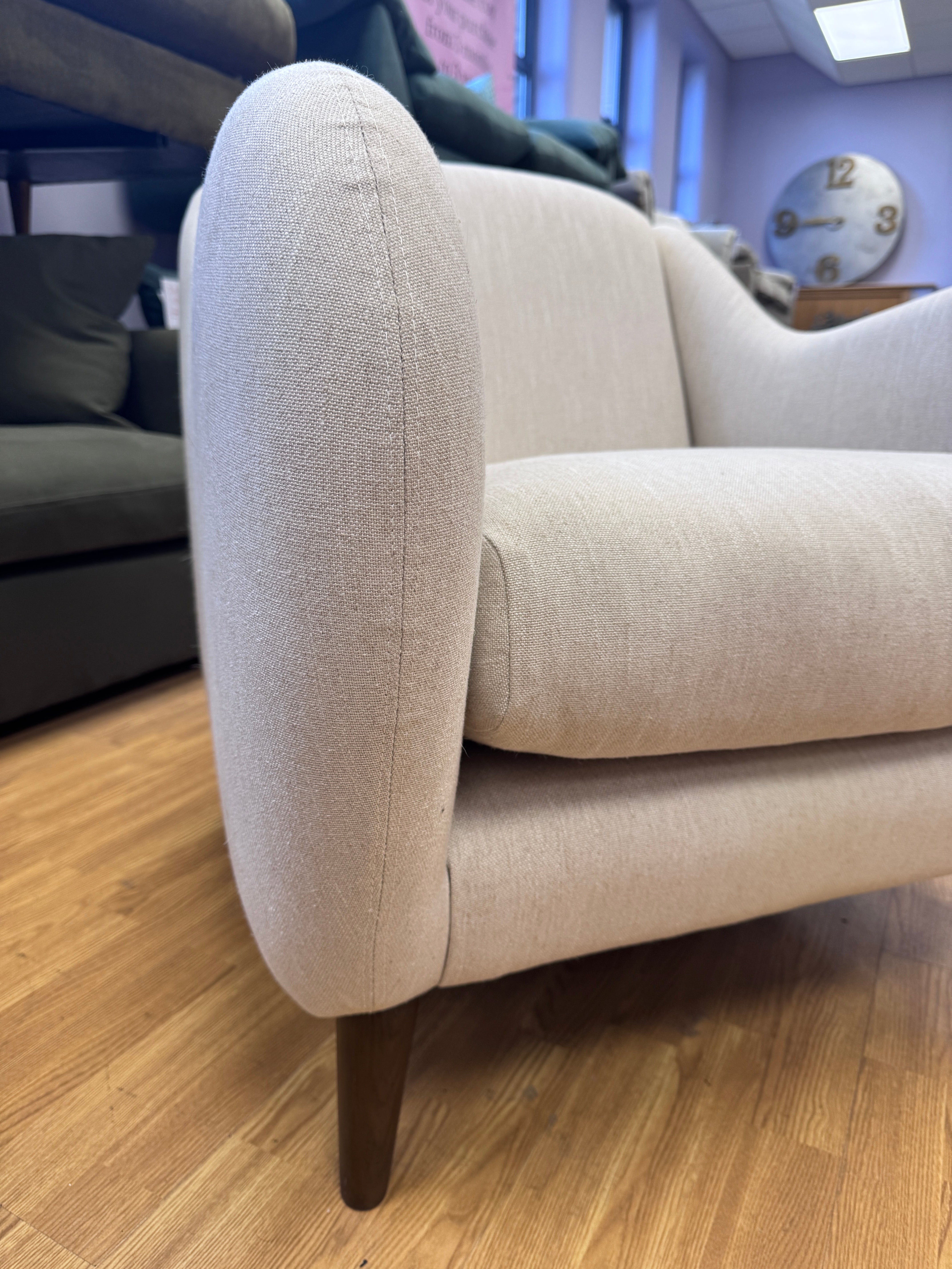 Sample fireside accent chair in Thatch house fabric