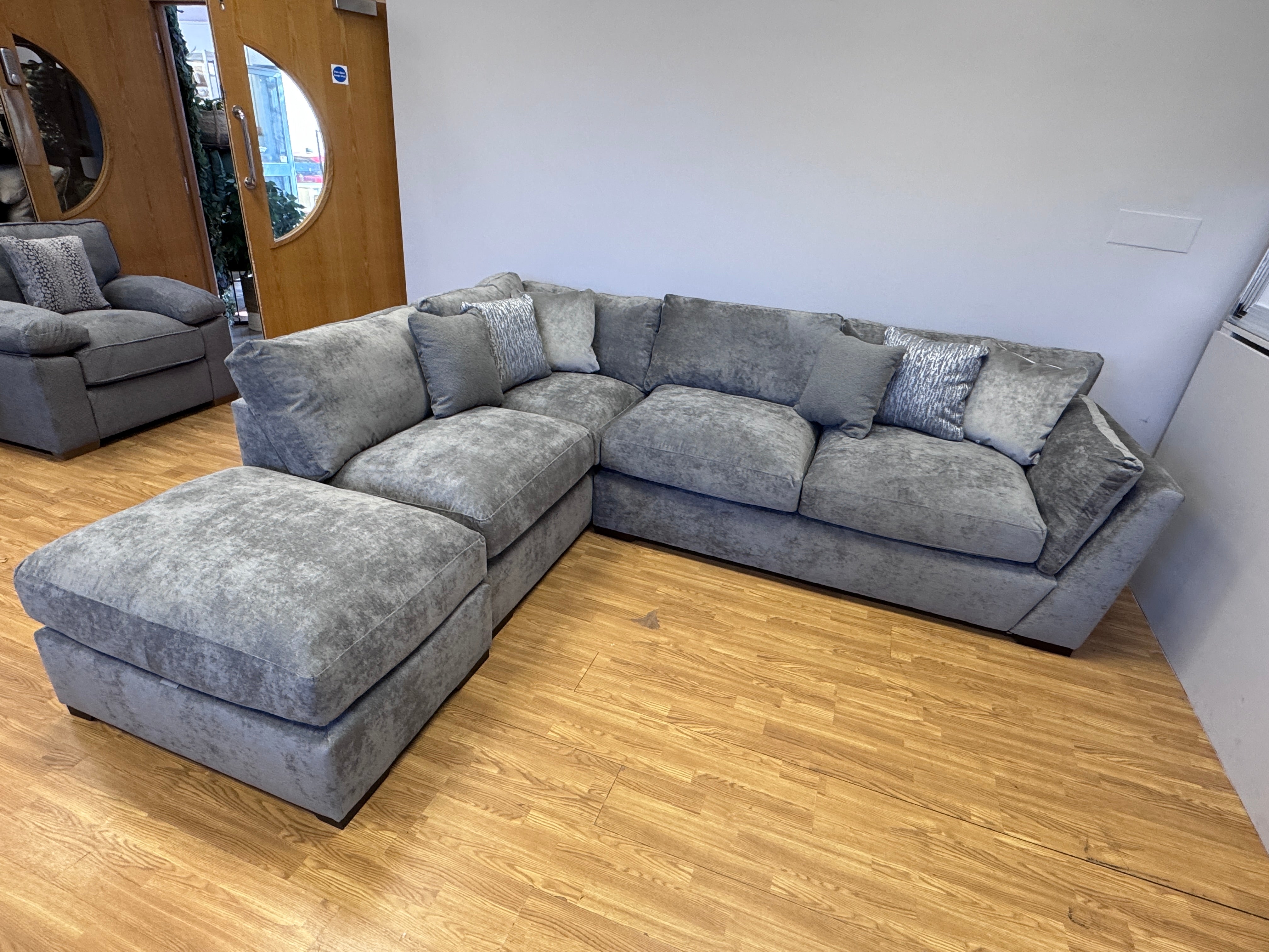 Phoenix left facing corner chaise sofa with footstool in Kingston Grey fabric