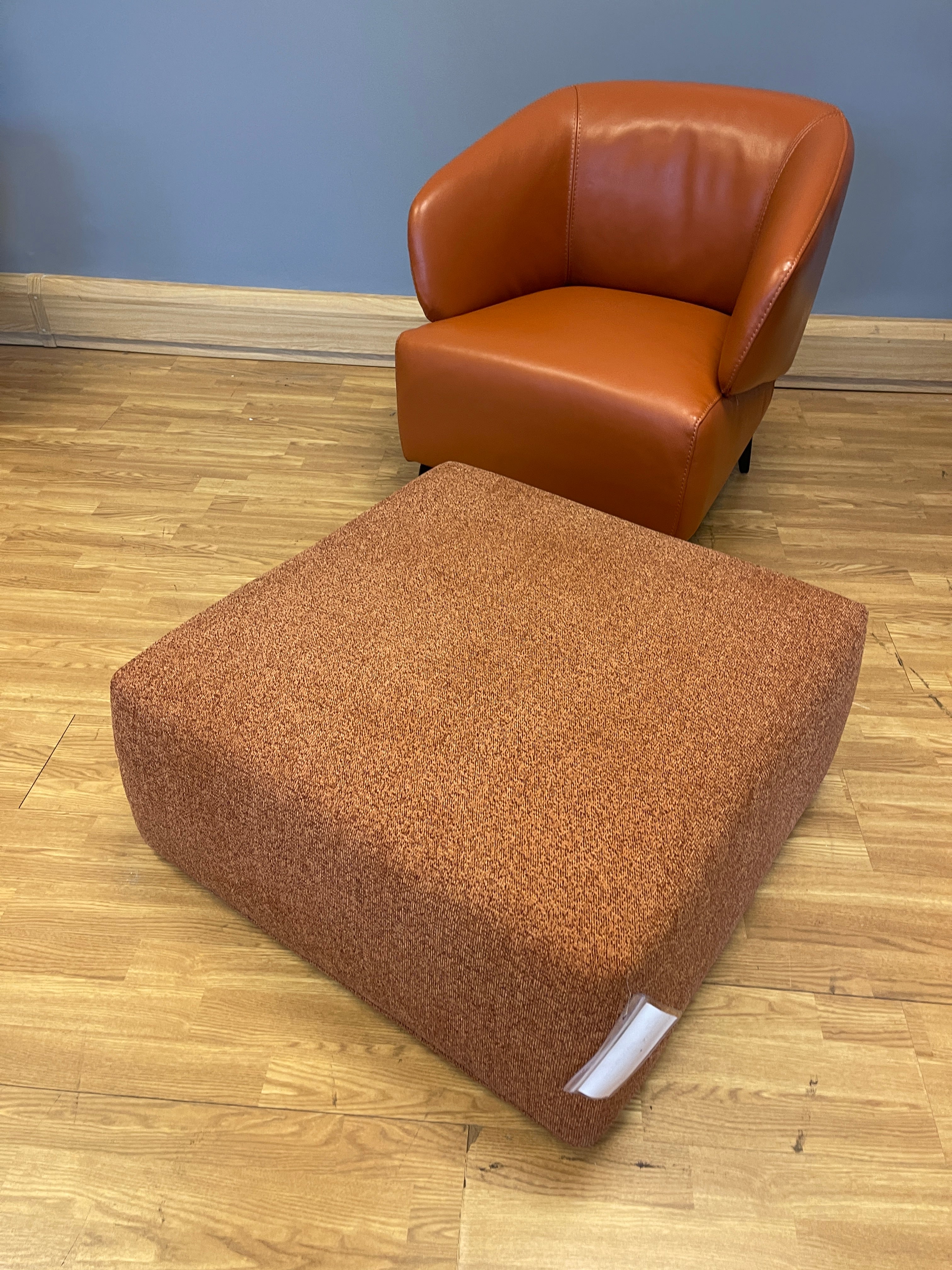 Sample square footstool in burnt orange weave