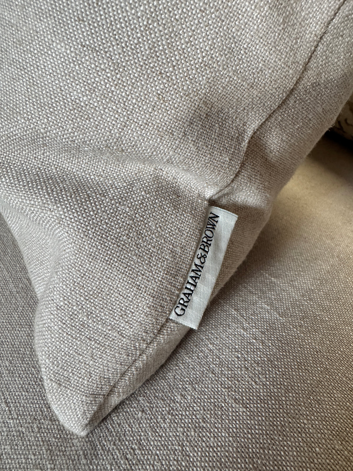 Haygarth loveseat / cuddle chair in natural linen fabric