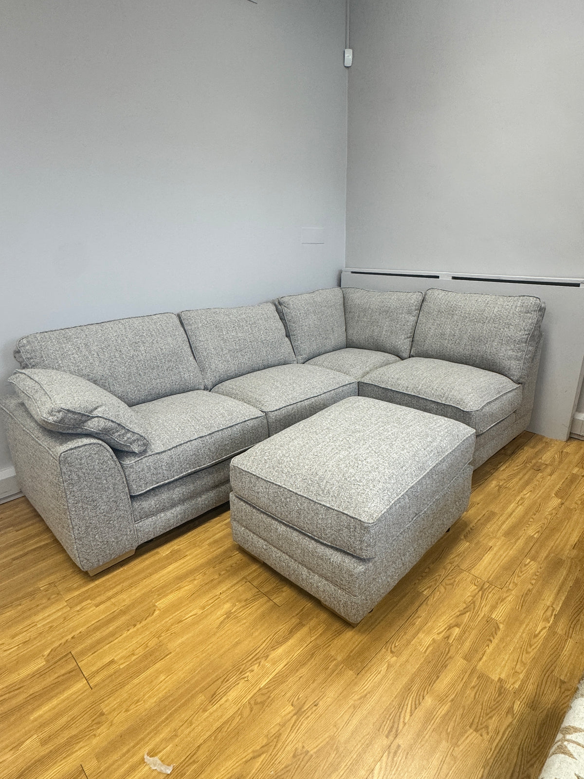 Proto right facing open corner sofa with footstool in Osaka Coppice fabric