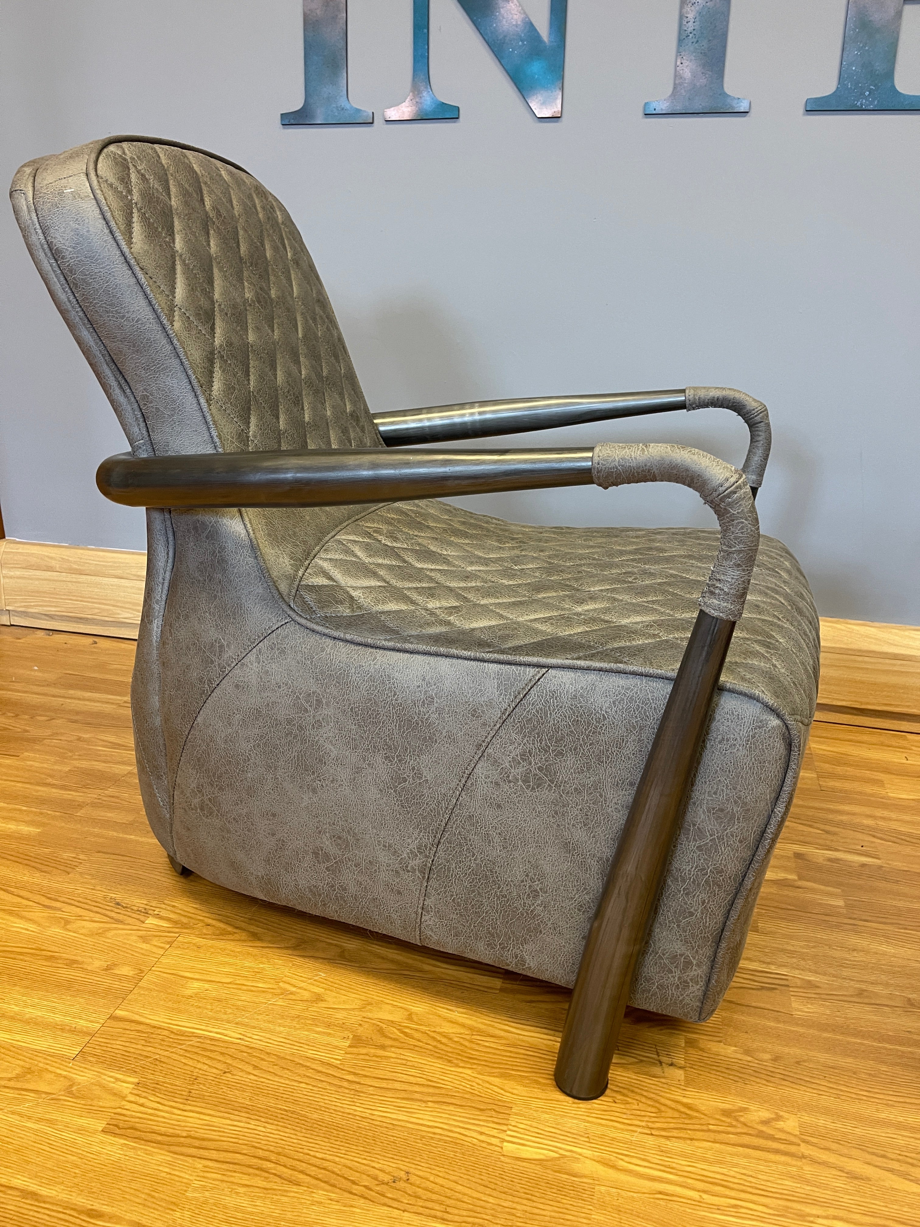 Manhattan accent chair in Milan faux leather & gunmetal base