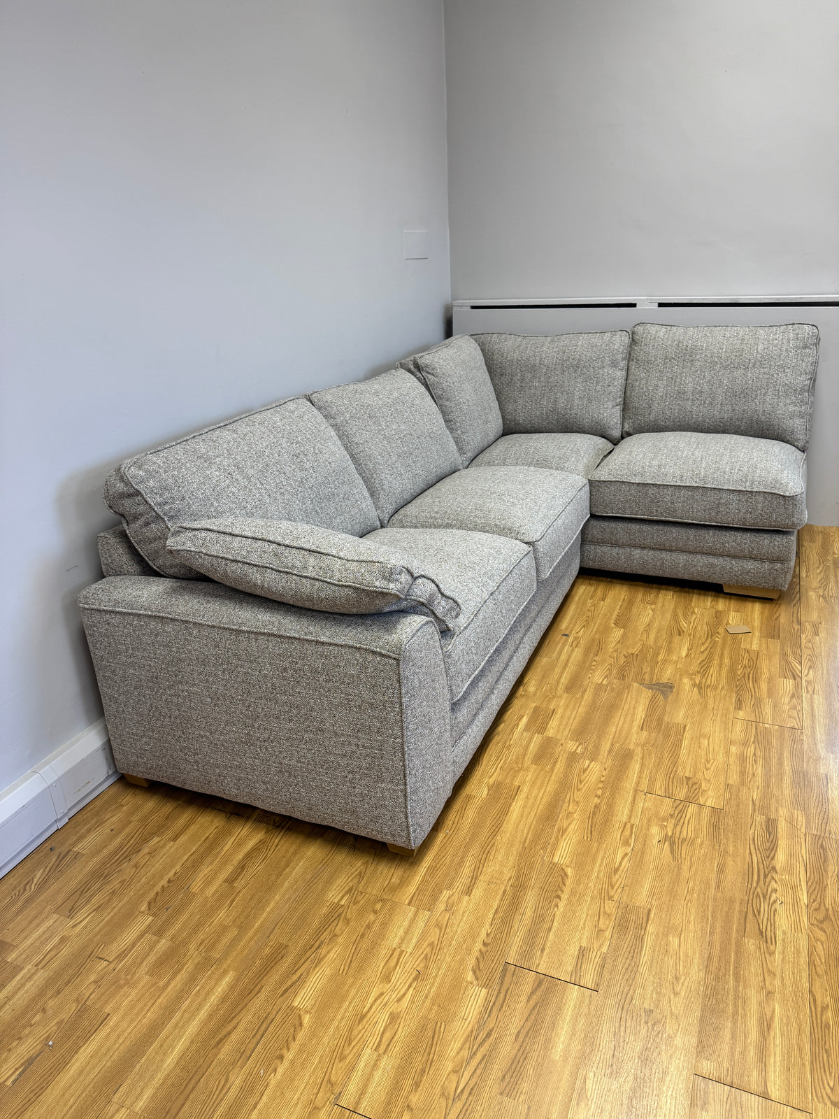 Proto right facing open corner sofa with footstool in Osaka Coppice fabric