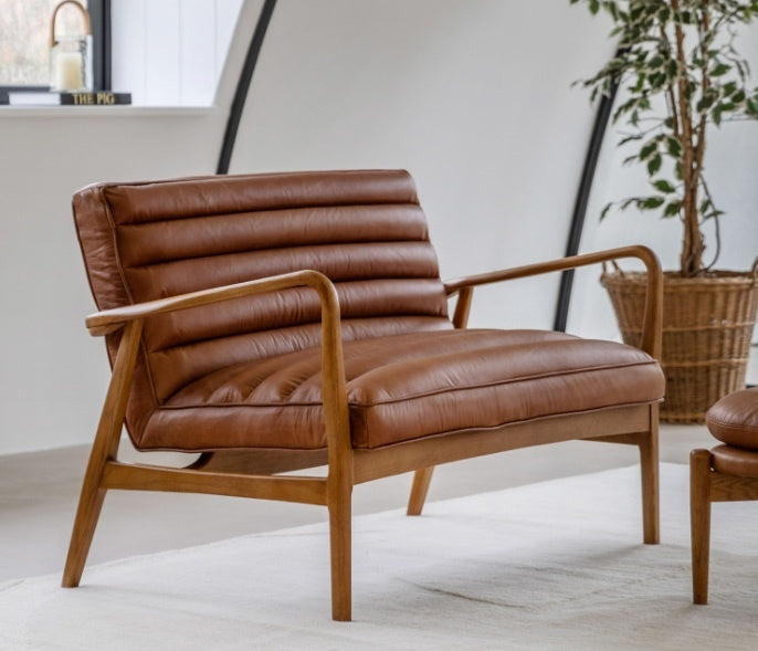 Datsun 2 seater ribbed leather sofa with oak frame