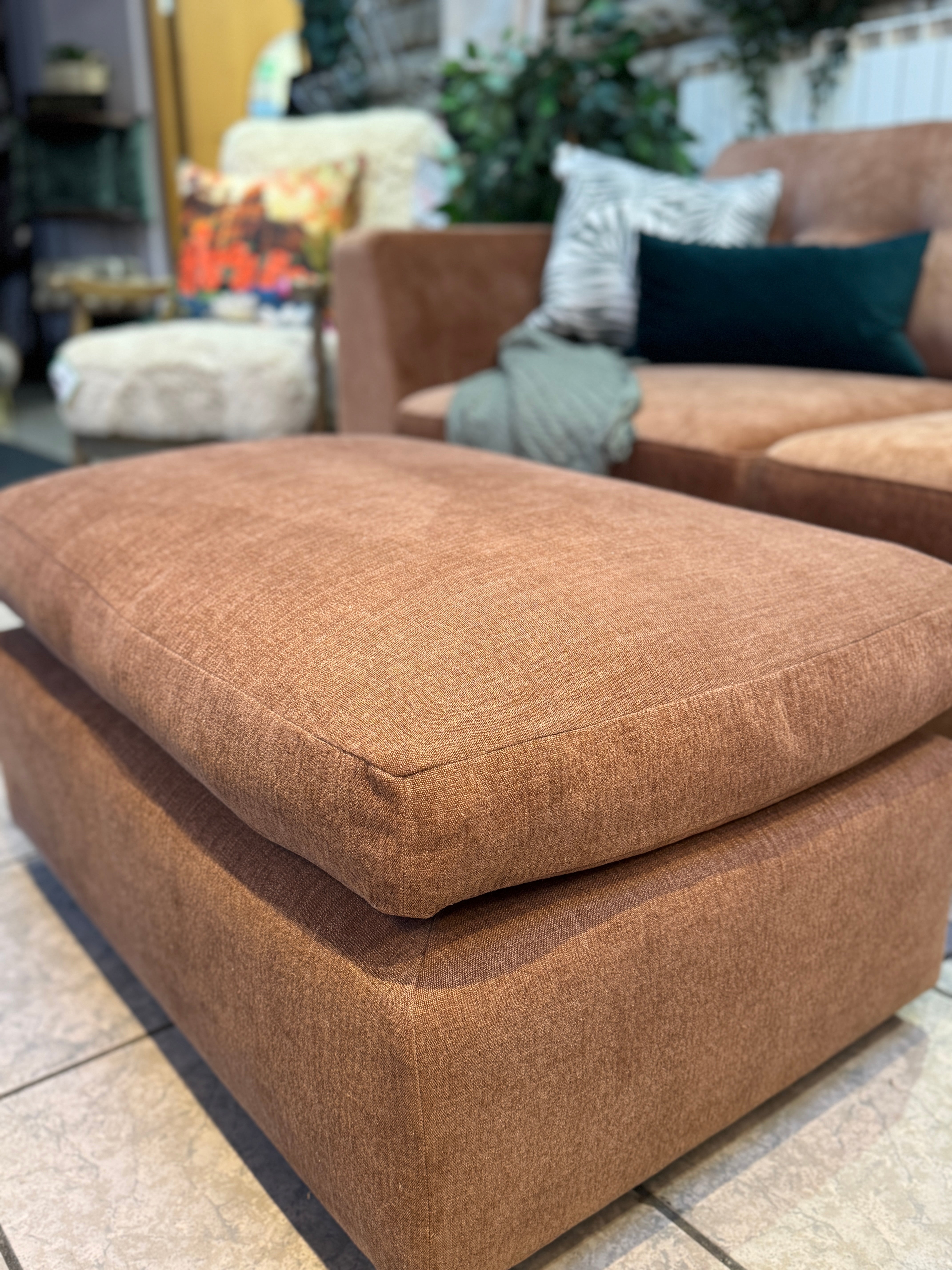 Designer rectangle padded top footstool in rust cotton fabric