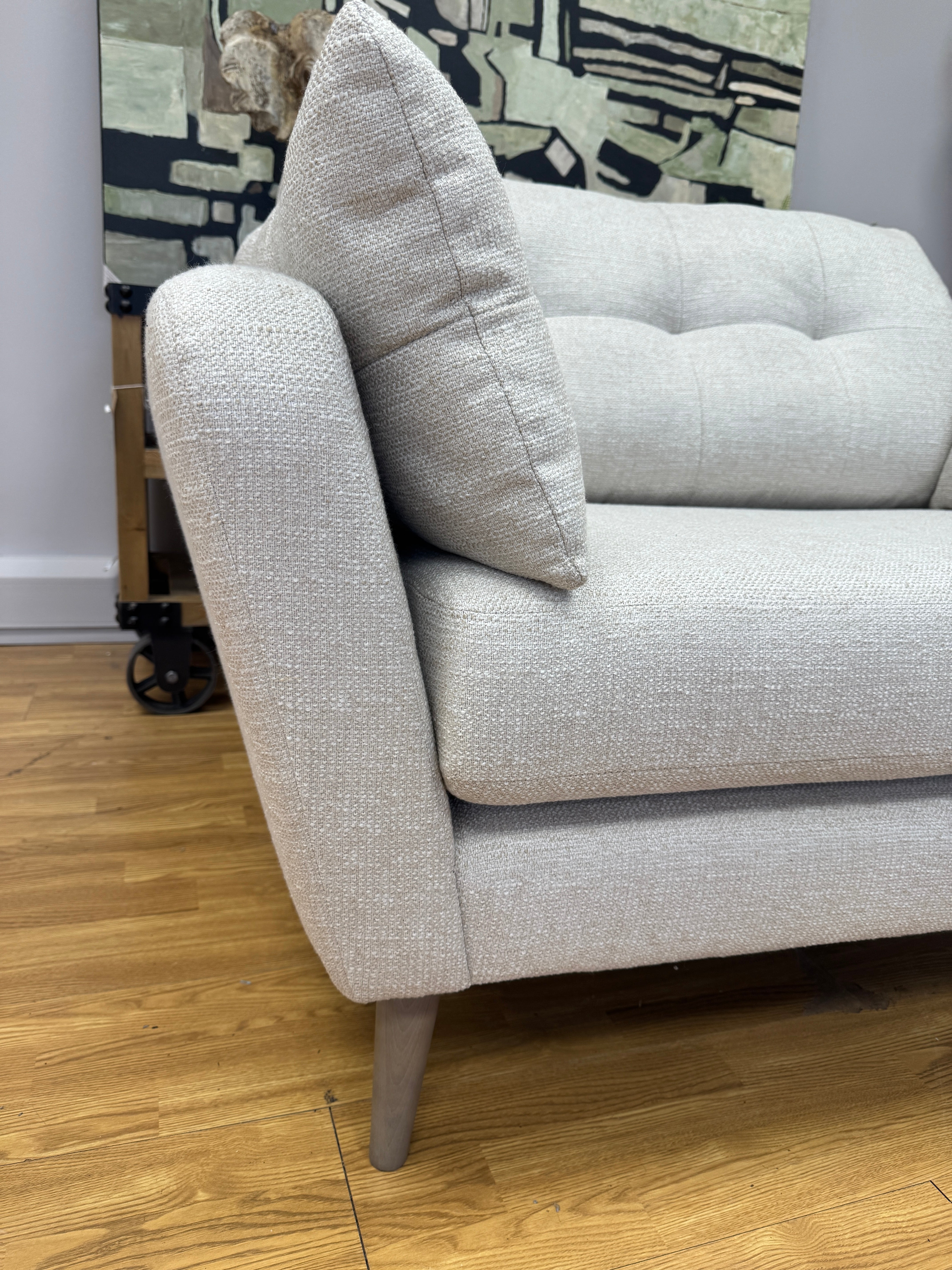 Lottie curved sided loveseat in natural soft weave fabric