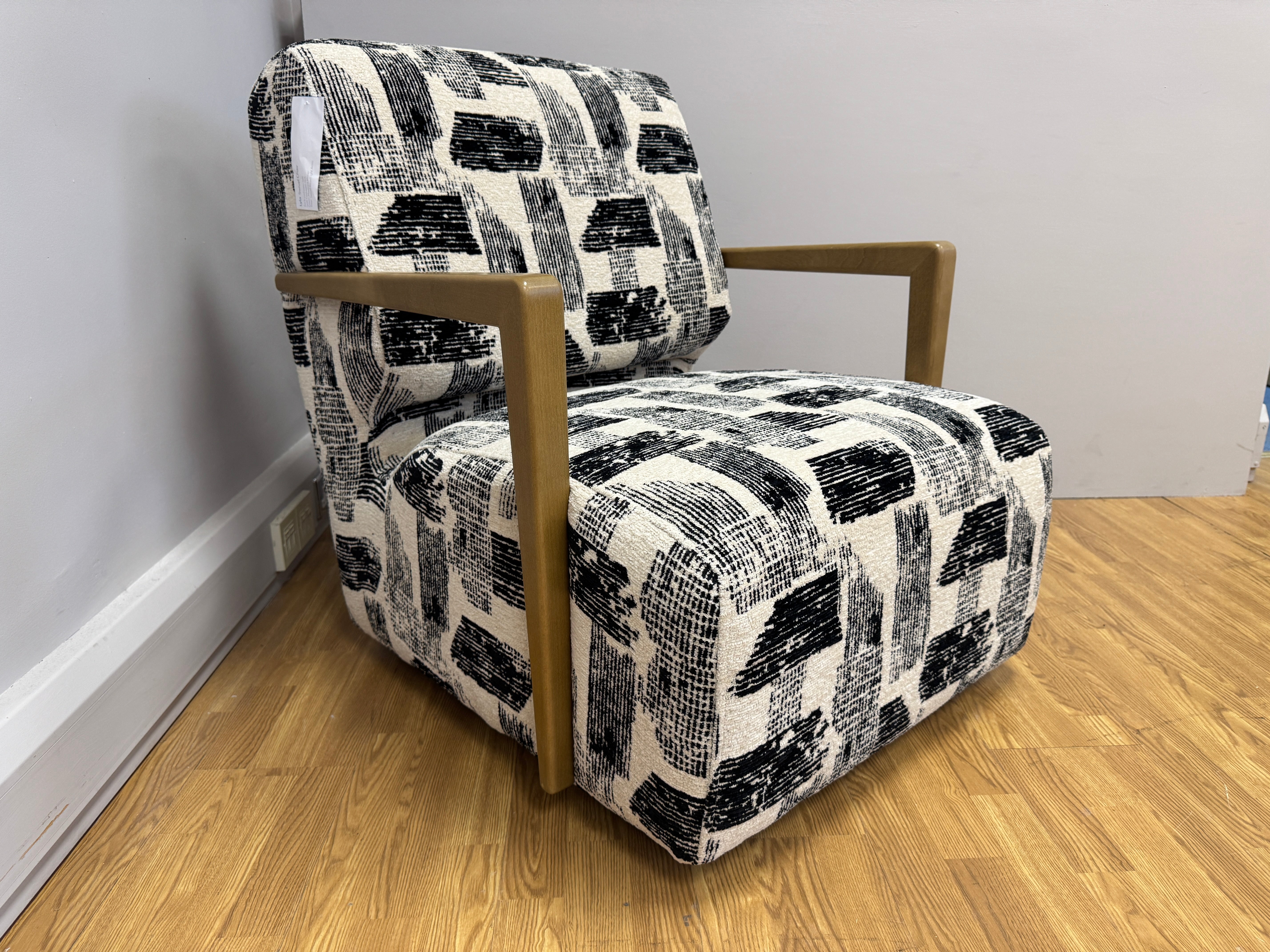 Lyla accent chair with swivel base and wooden arms in Maverick mono velvet fabric