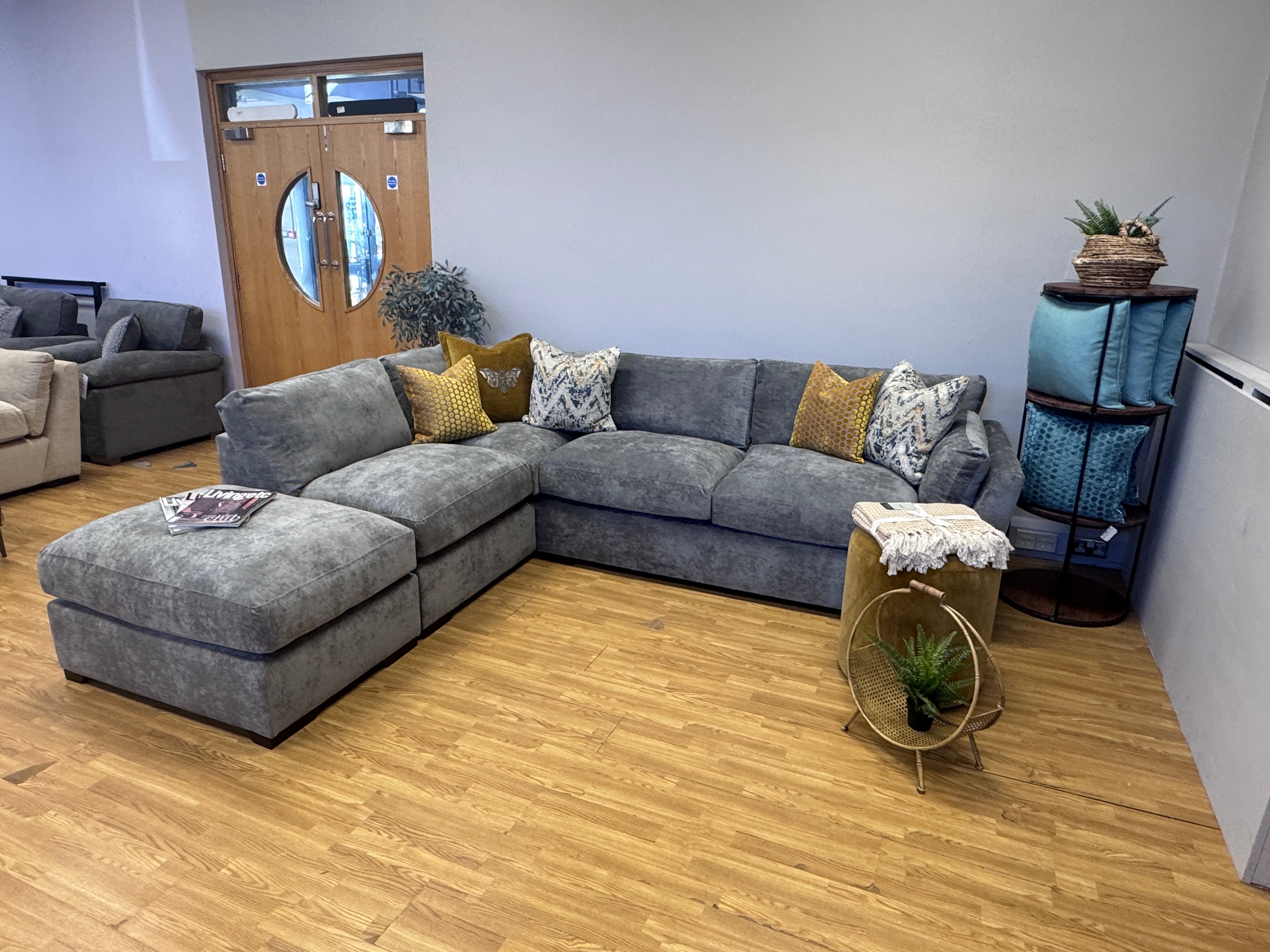 Phoenix left facing corner chaise sofa with footstool in Kingston Grey fabric