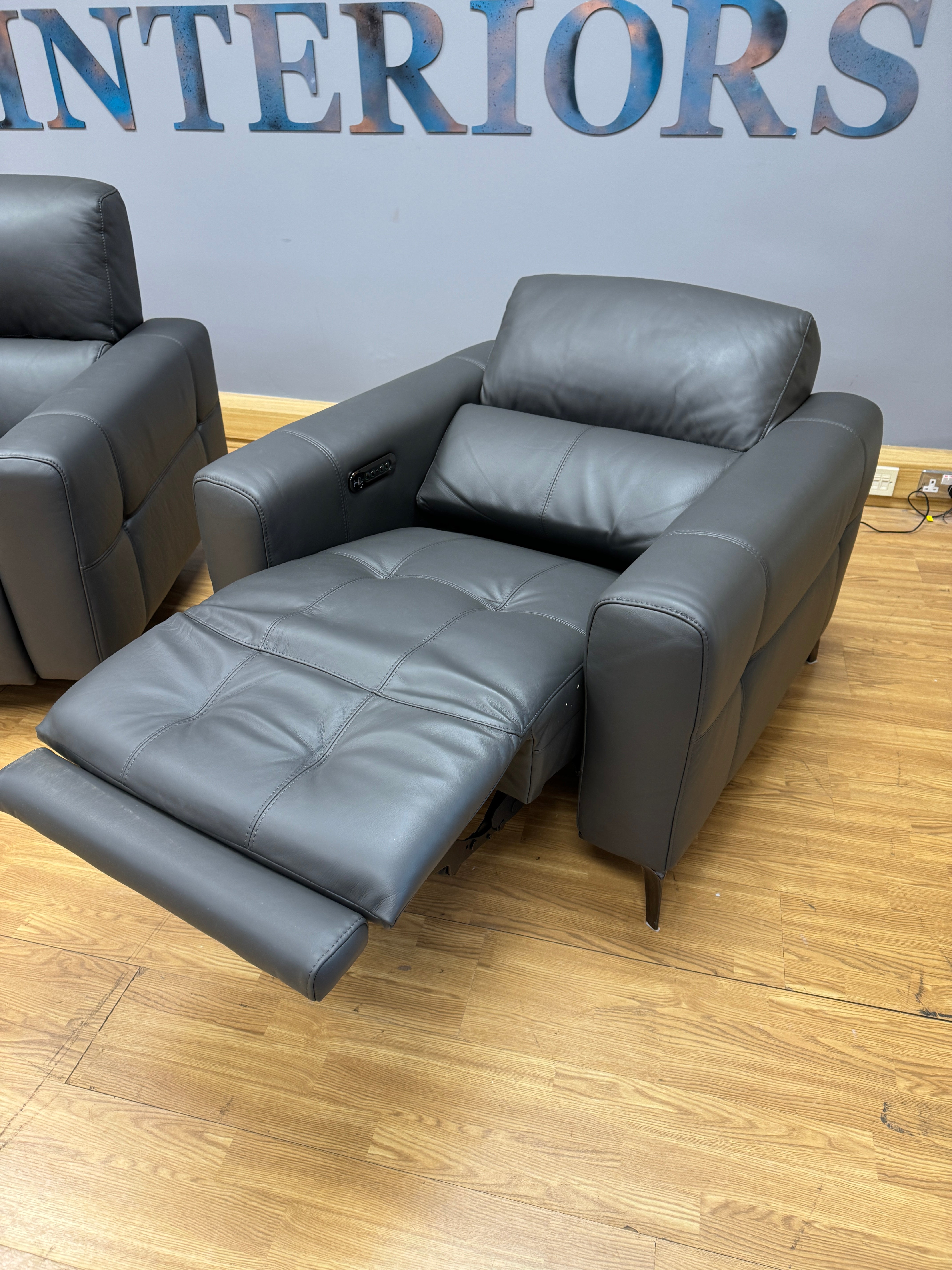 New York pair of matching reclining armchairs in dark grey leather