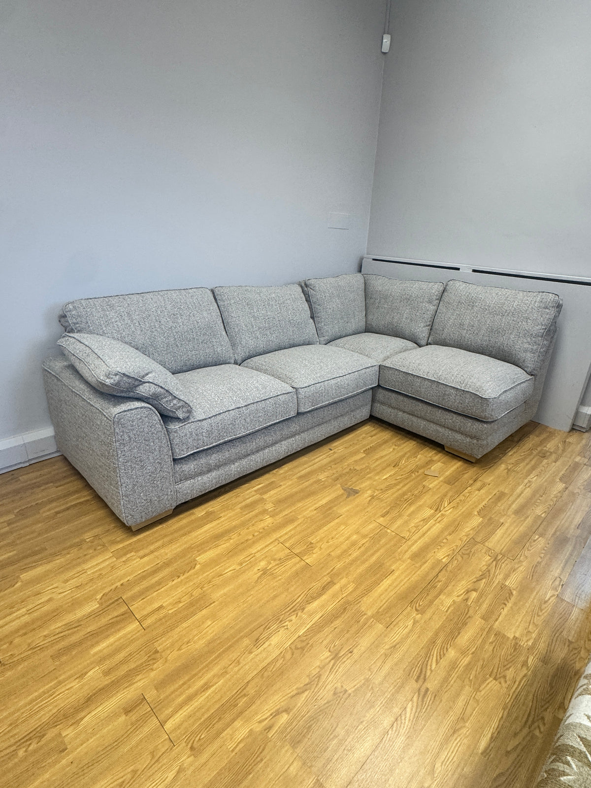 Proto right facing open corner sofa with footstool in Osaka Coppice fabric