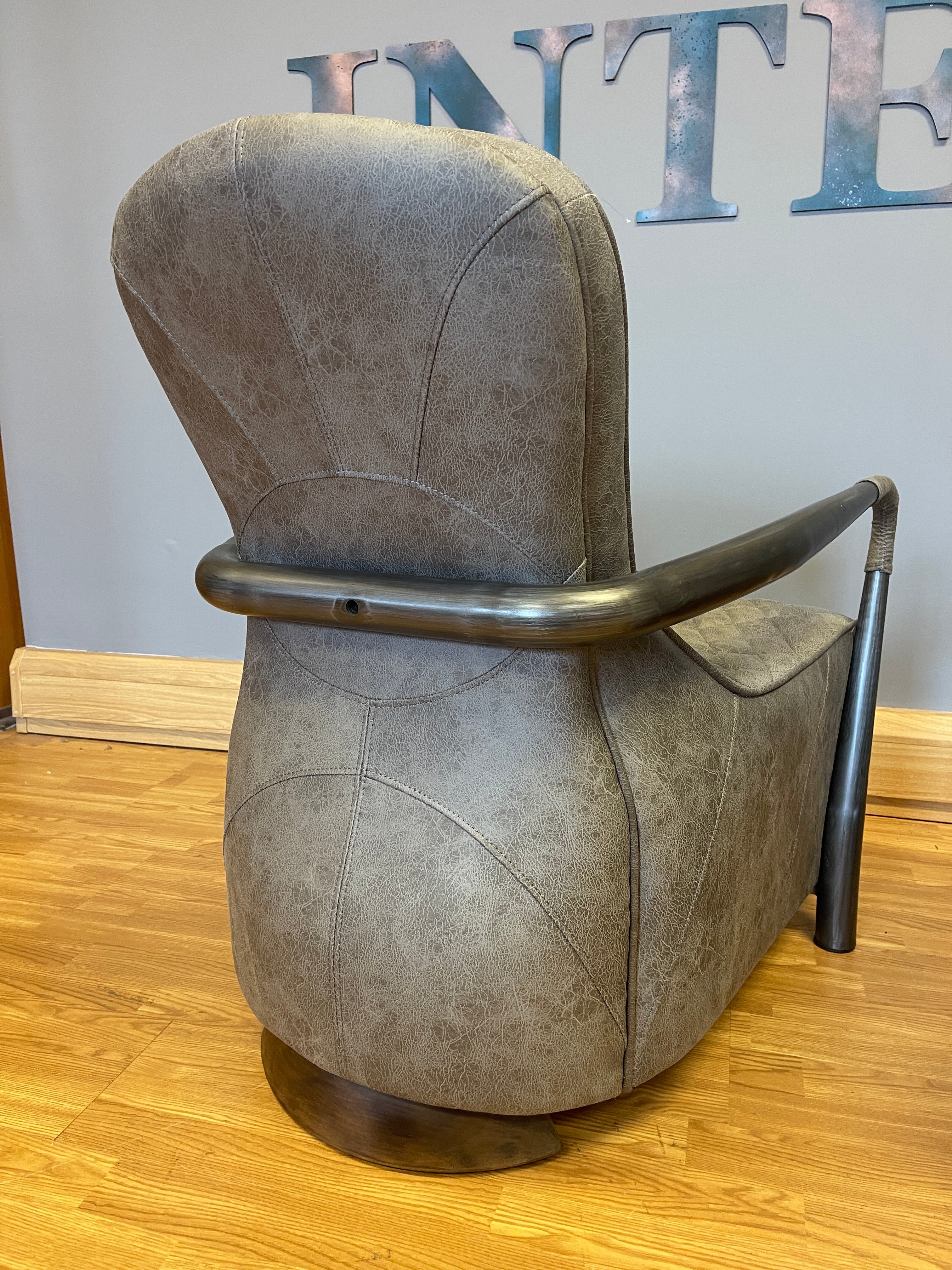 Manhattan accent chair in Milan faux leather & gunmetal base