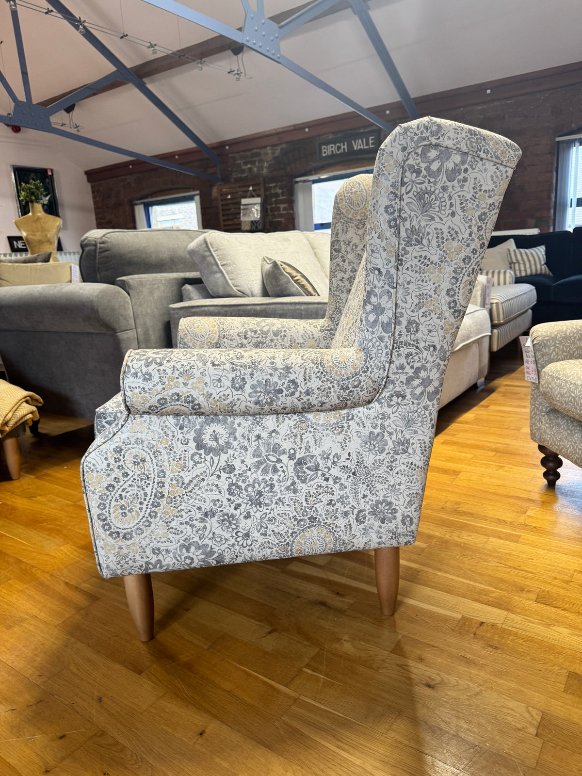 Heather wingback accent chair in grey / ochre Paisley print fabric