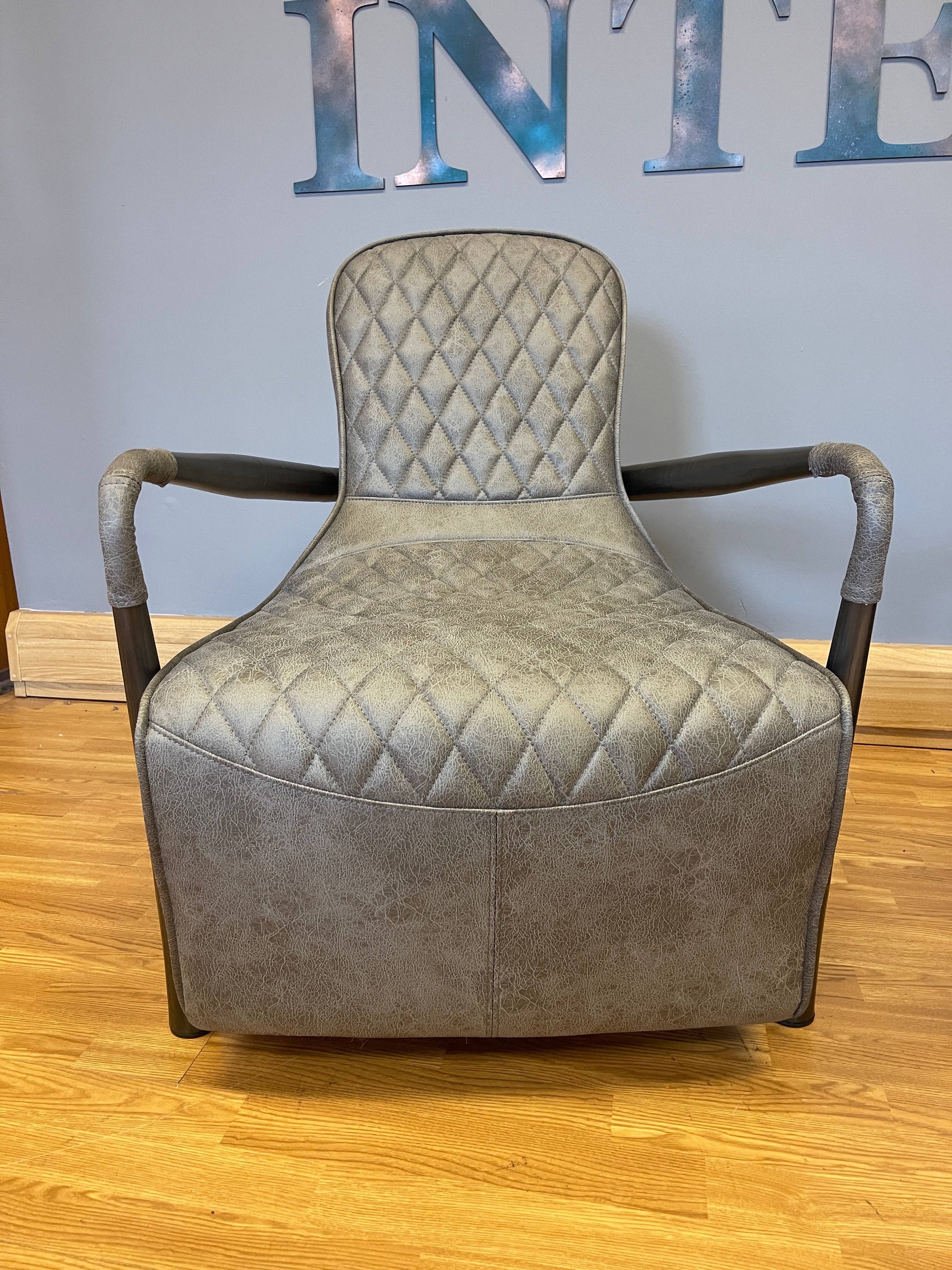 Manhattan accent chair in Milan faux leather & gunmetal base