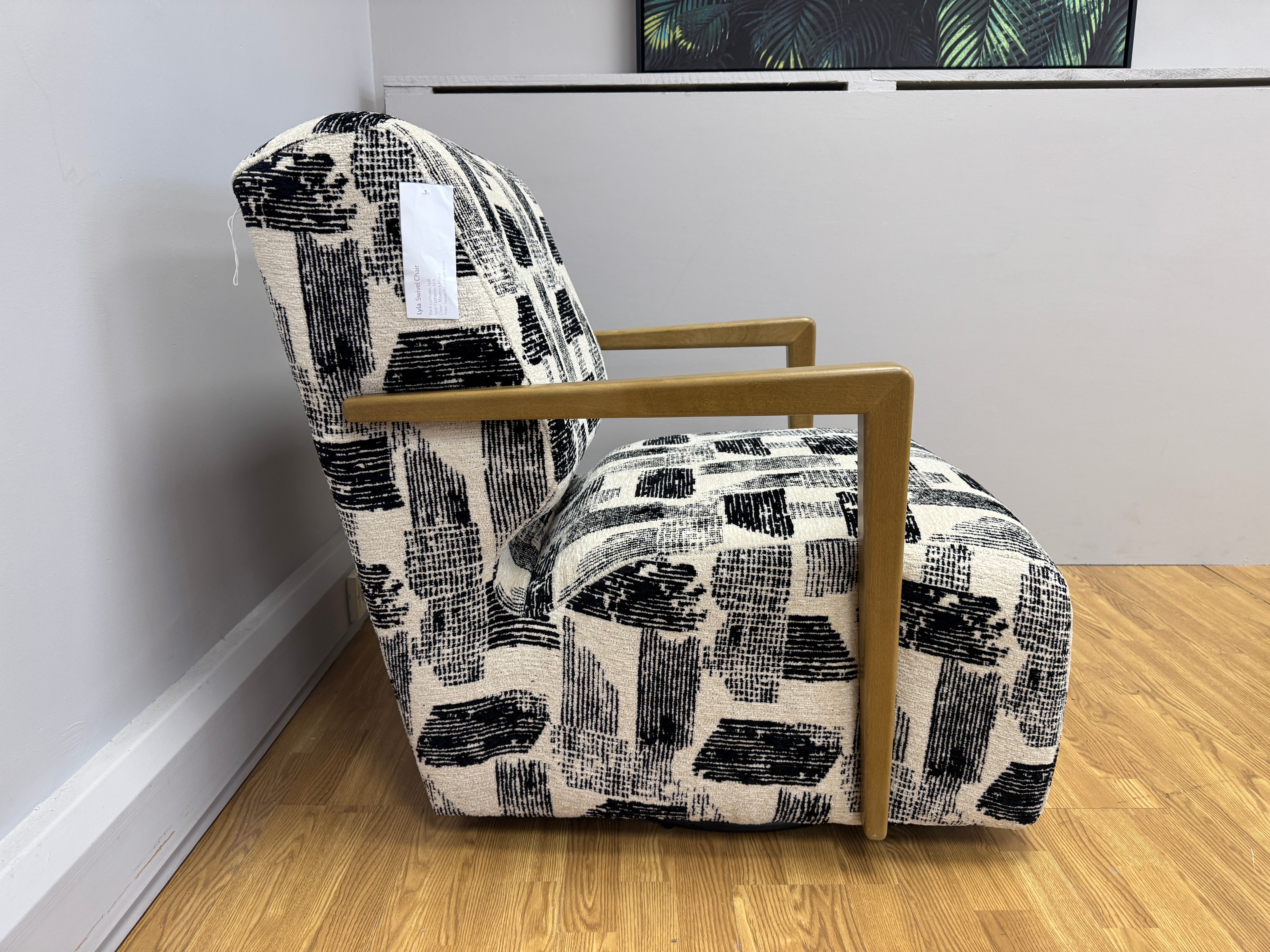 Lyla accent chair with swivel base and wooden arms in Maverick mono velvet fabric