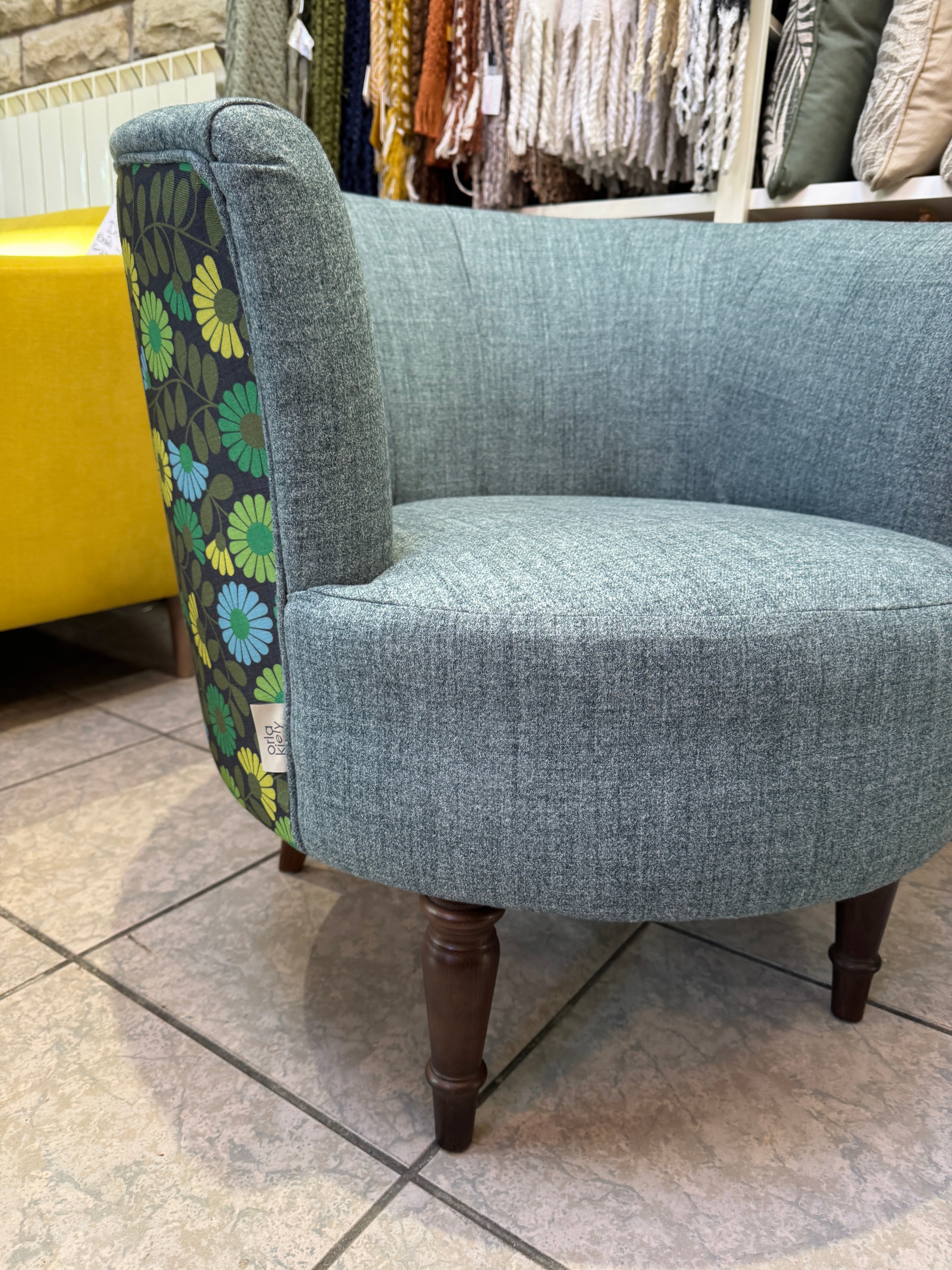 Orla Kiely Lily round tub chair in teal and multi daisy print fabric