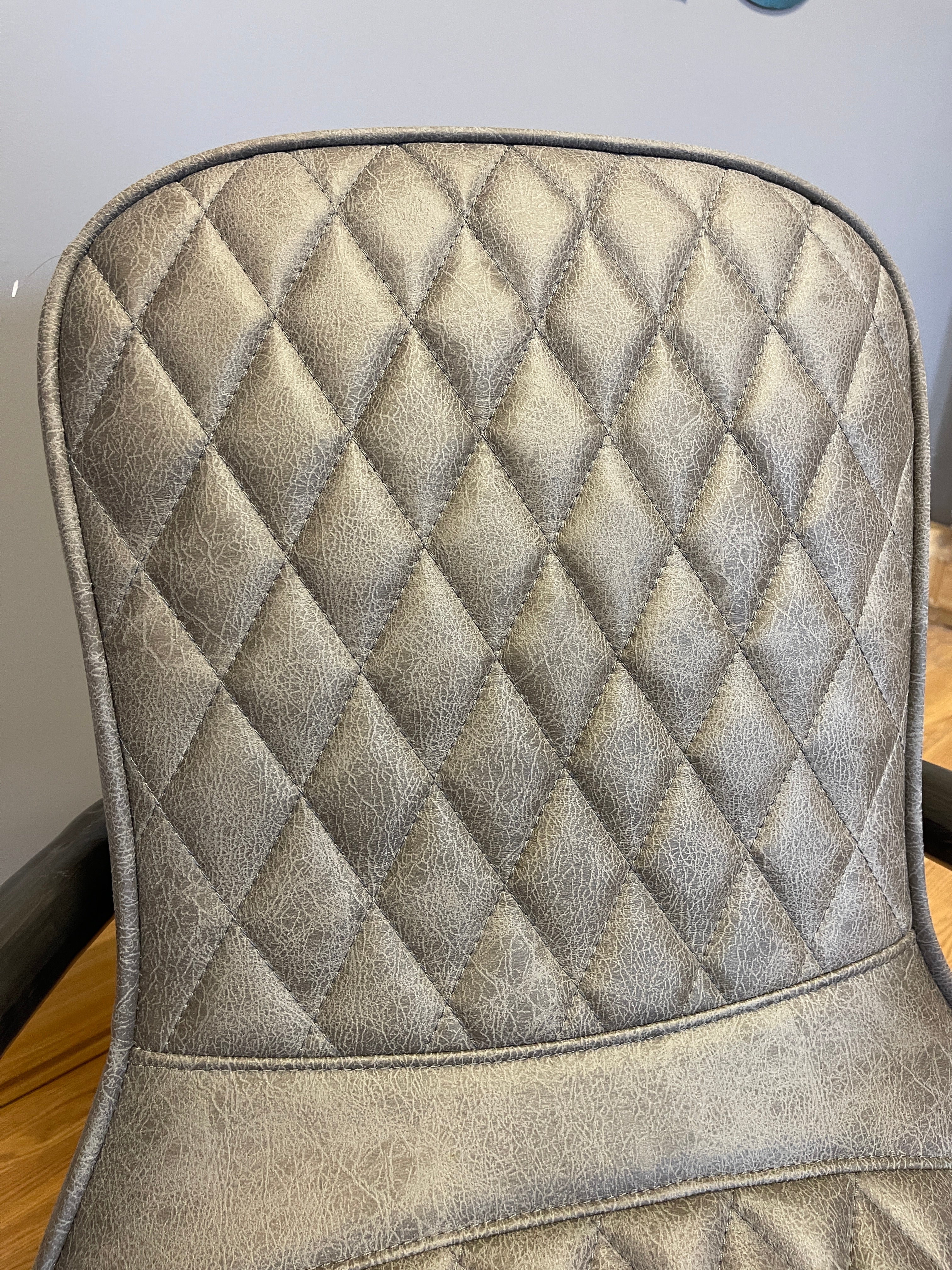 Manhattan accent chair in Milan faux leather & gunmetal base