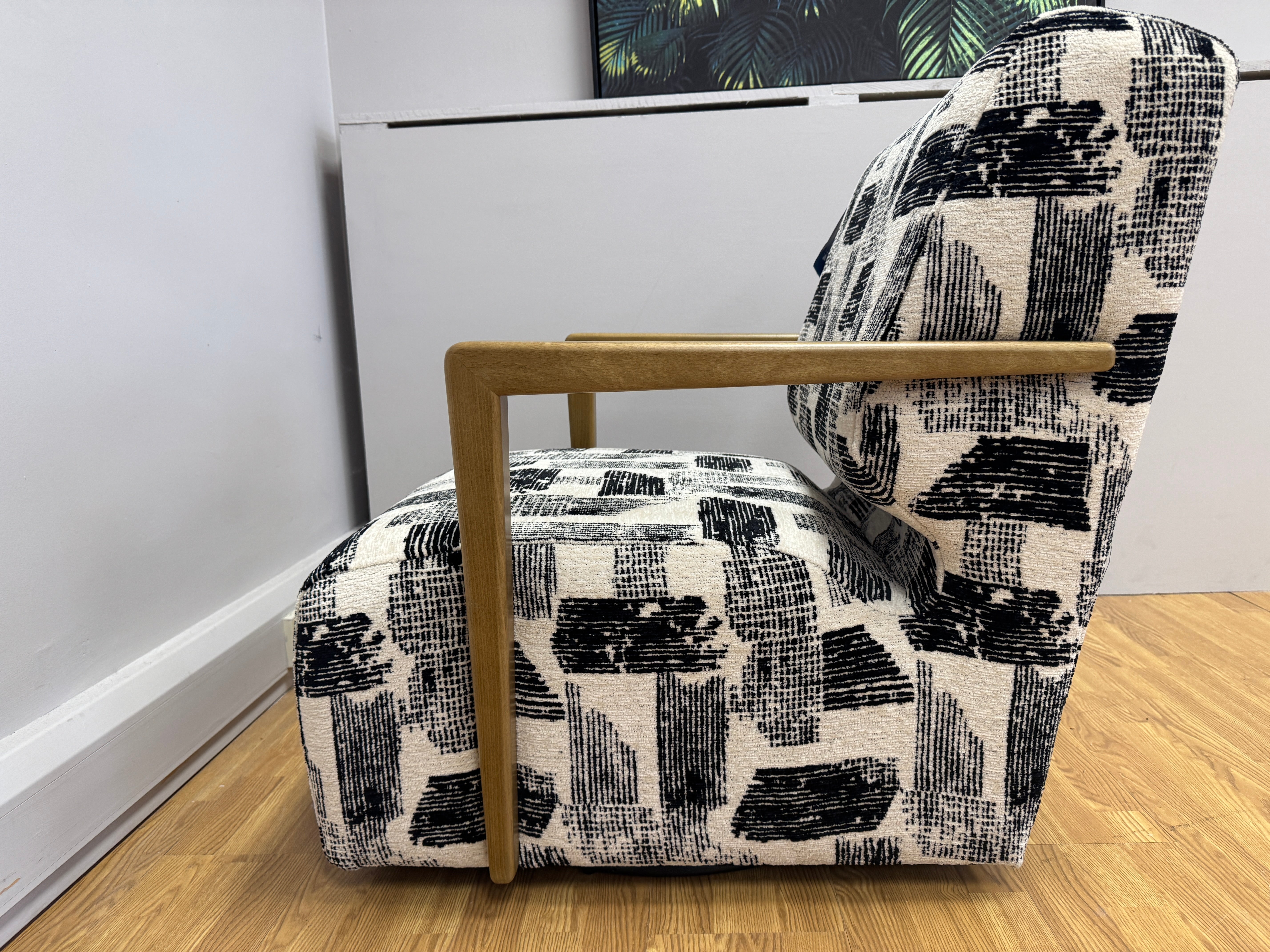 Lyla accent chair with swivel base and wooden arms in Maverick mono velvet fabric