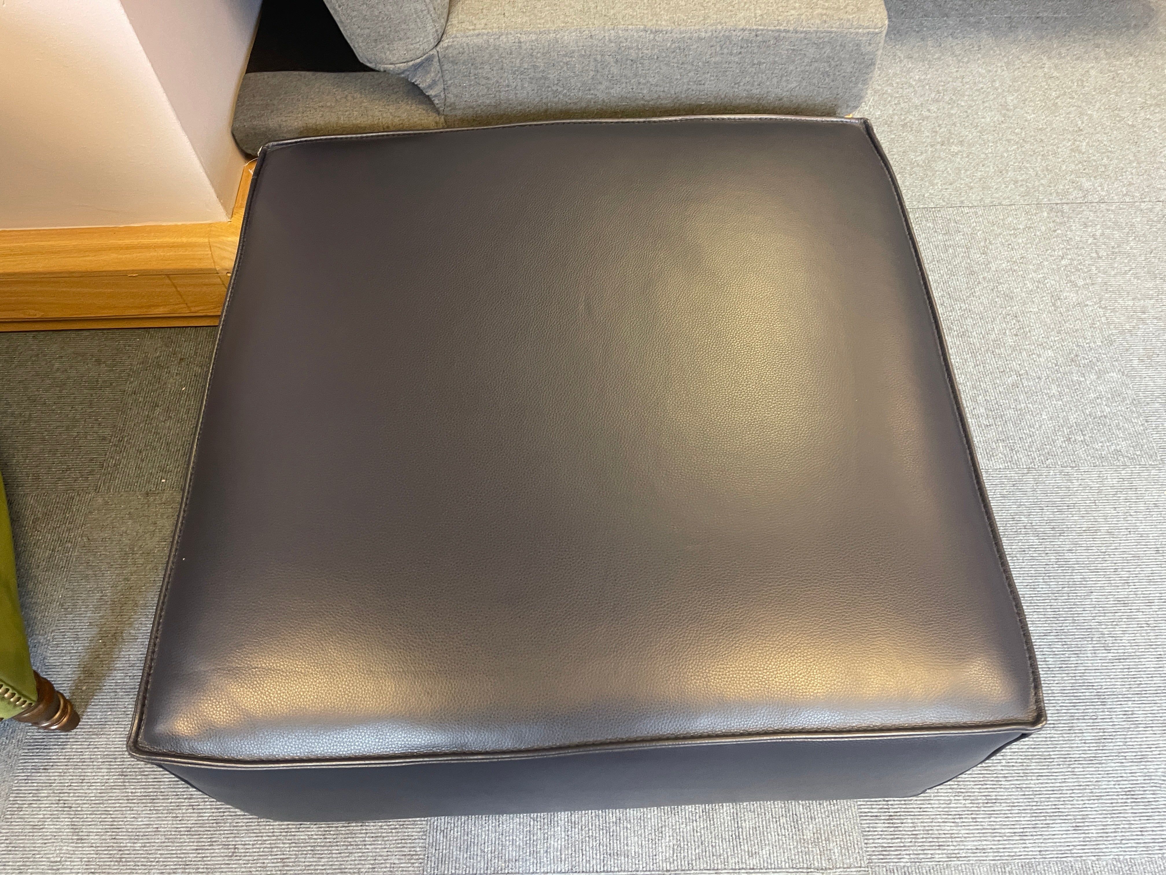 Sample low square shape footstool with side storage in navy blue leather