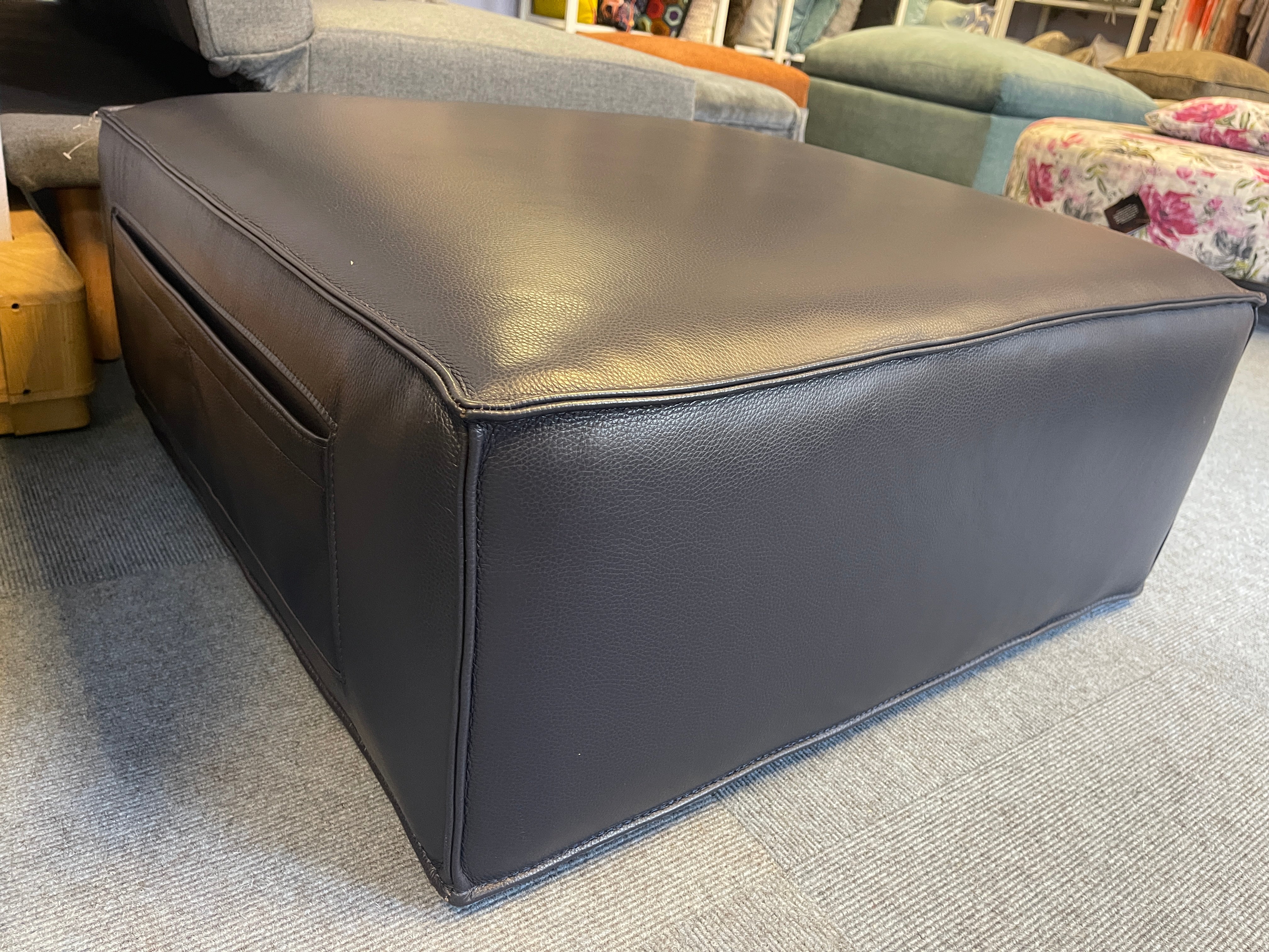 SAMPLE low square shape footstool with side storage in navy blue leather